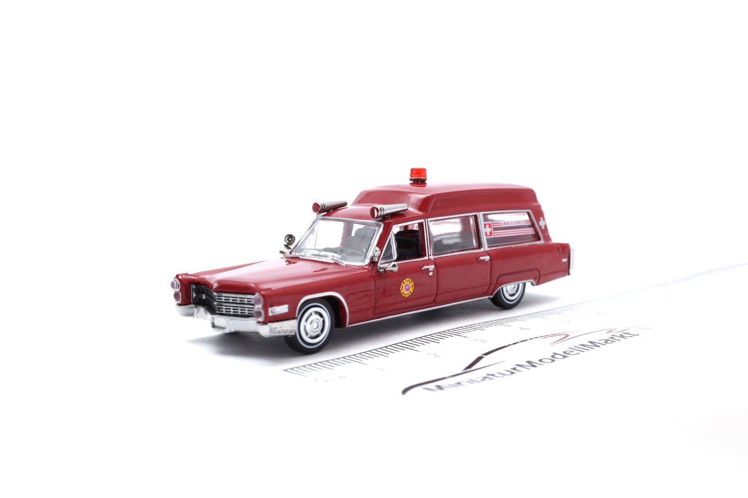 Brekina 19775 Cadillac Miller Meteor Ambulance - dunkelrot 1:87