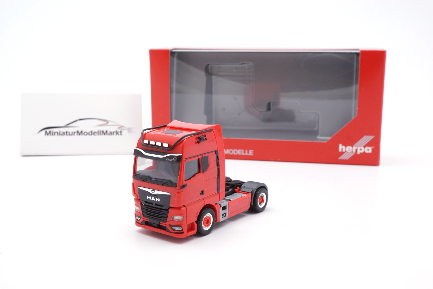 Herpa 313711 MAN TGX GX Individual Lion Zugmaschine - rot 1:87