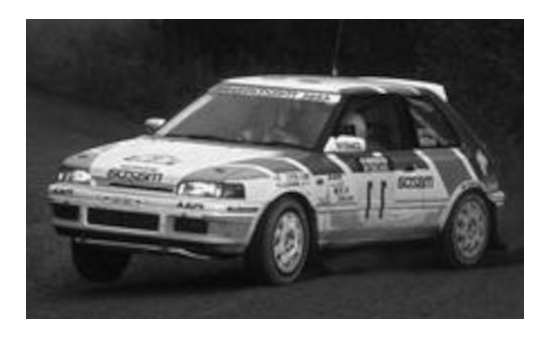 IXO RAC358B Mazda 323 GTX, No.11, Mazda Rally Team Europe, Rallye WM, 1000 Lakes Rallye, with night lights, H.Mikkola/A.Hertz, 1990 1:43
