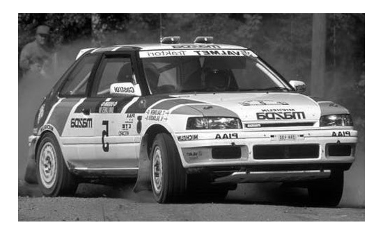 IXO RAC358A Mazda 323 GTX, No.5, Mazda Rally Team Europe, Rallye WM, 1000 Lakes Rallye, with night lights, T.Salonen/V.Silander, 1990 1:43